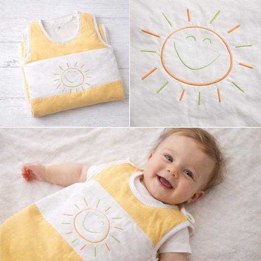 Detailaufnahme des gestickten Sonnenmotivs auf gelb-weißem Babyschlafsack aus Baumwoll