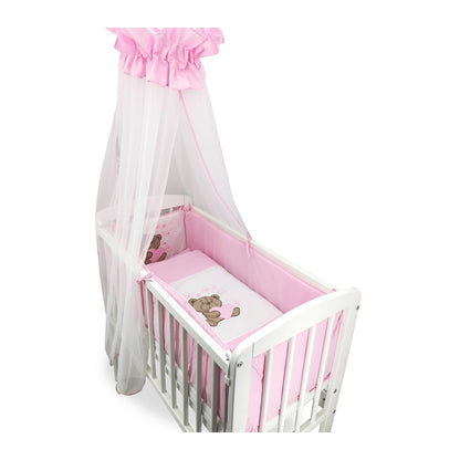 Romantisches Babybett mit rosa Ausstattung und Baldachin